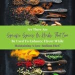 Herbs and spices for cooking on dark background