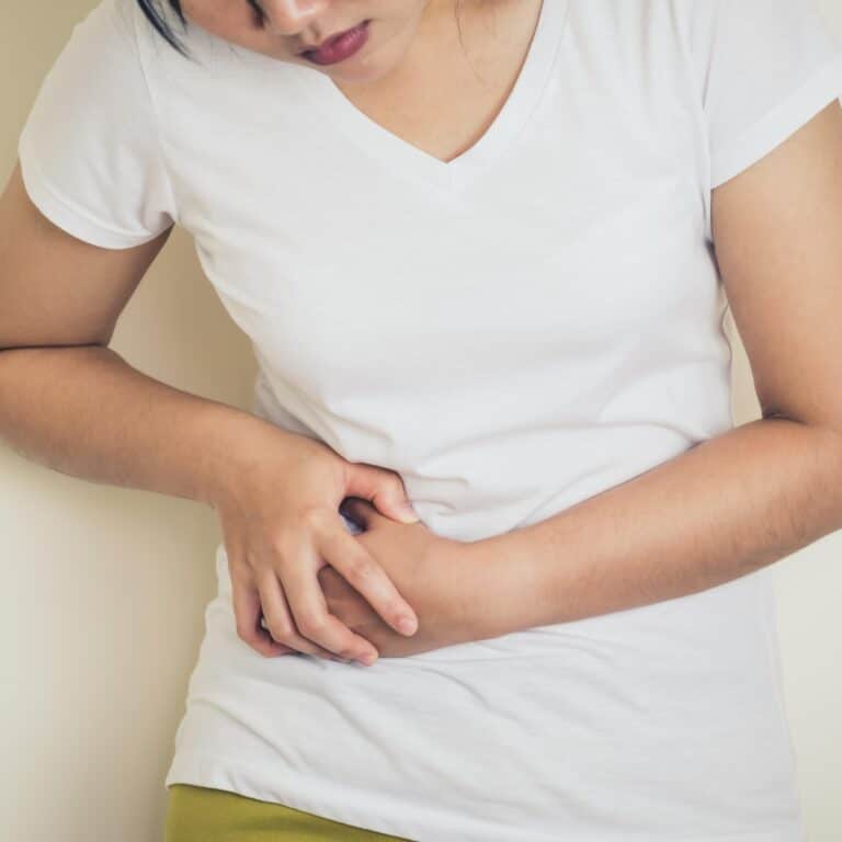 Young Woman Suffering from Pain Kidney Disease