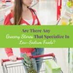 Woman in the grocery store looking a packet of cereals