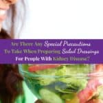 Woman holding a bowl of vegetable salad