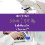 Working in lab with microscope and writing results on laptop