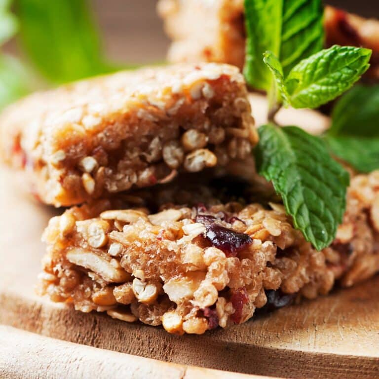 nutrition bars displayed with mint on a serving board