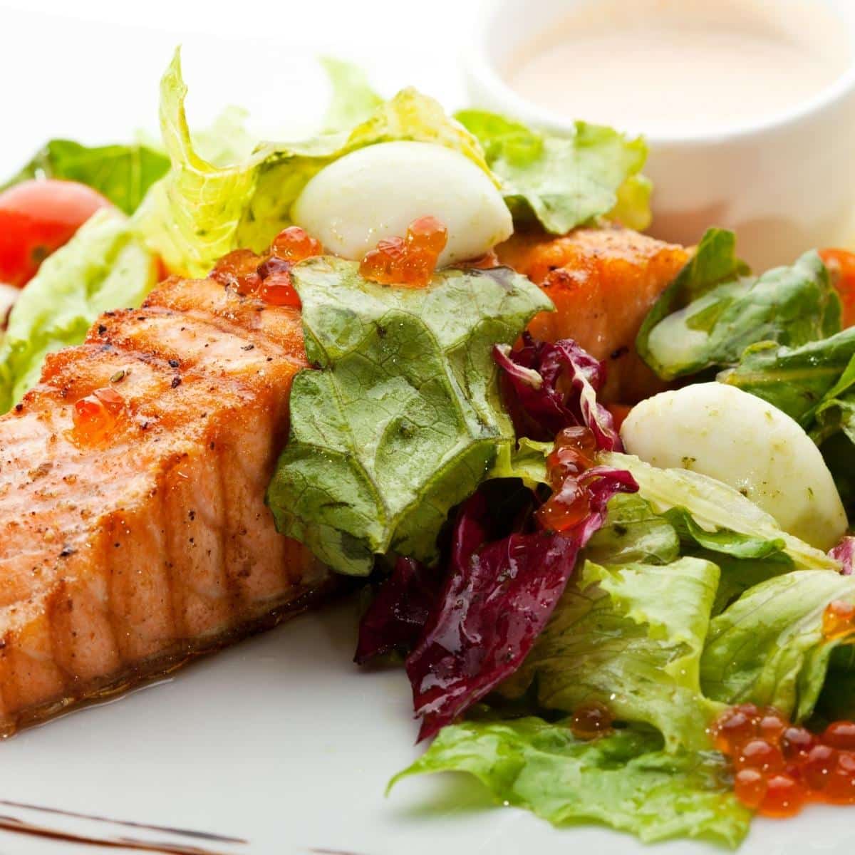 Salmon Steak with veggies and ranch dressing