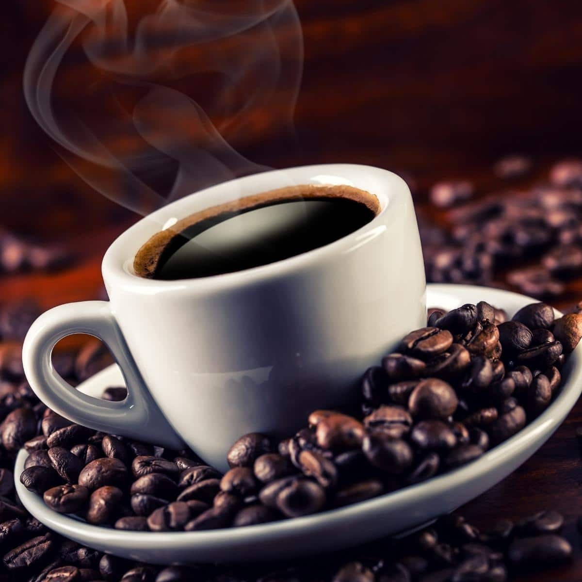 Can You Have Coffee On A Renal Diet? Cup of coffee and spilled coffee beans