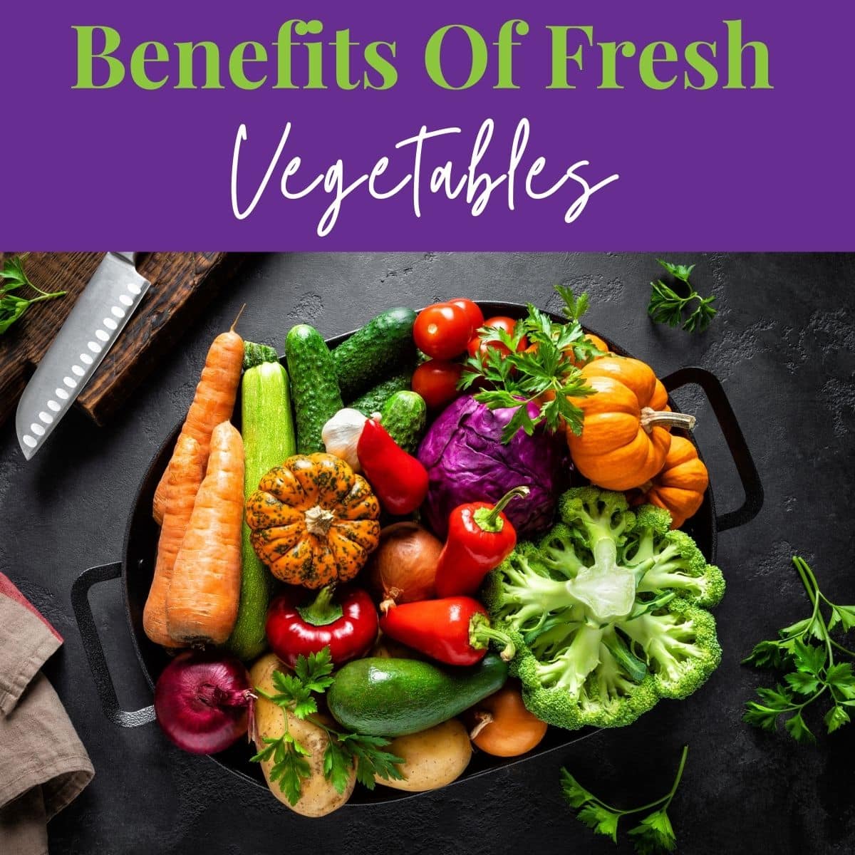 Culinary background with fresh raw vegetables on a black kitchen table