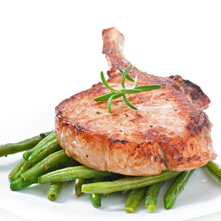 Juicy grilled pork fillet steak with with green beans