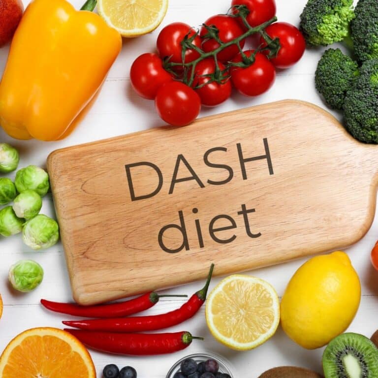 Assortment of healthy vegetables and Wooden chopping board.