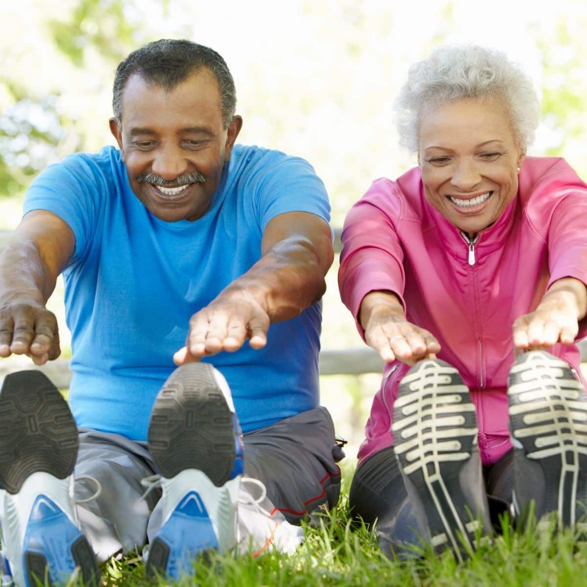 Senior Couple Exercising In Park