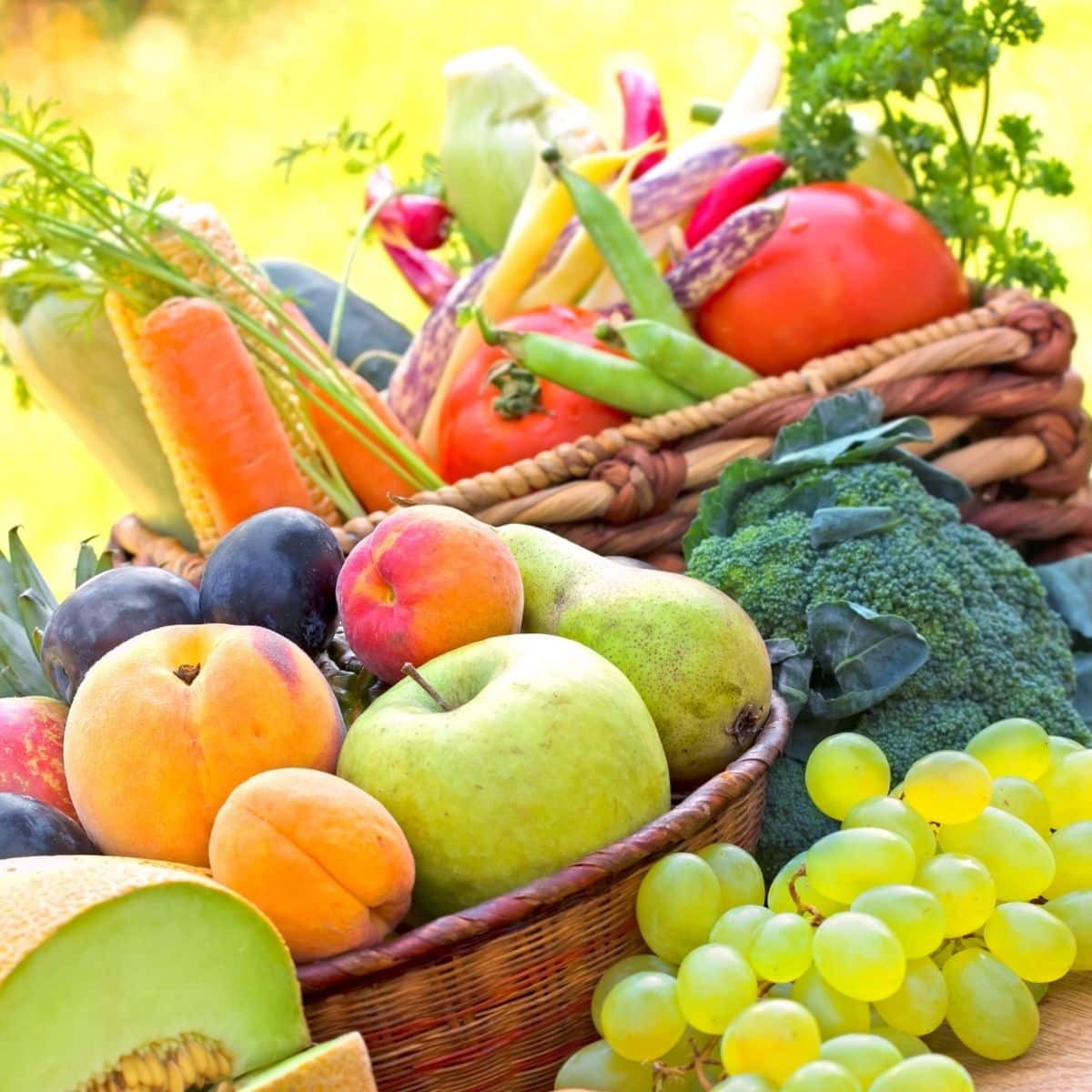 Two baskets of Fresh organic fruits and vegetables