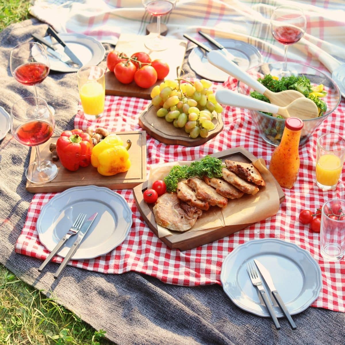 Blanket with food prepared for summer picnic outdoors