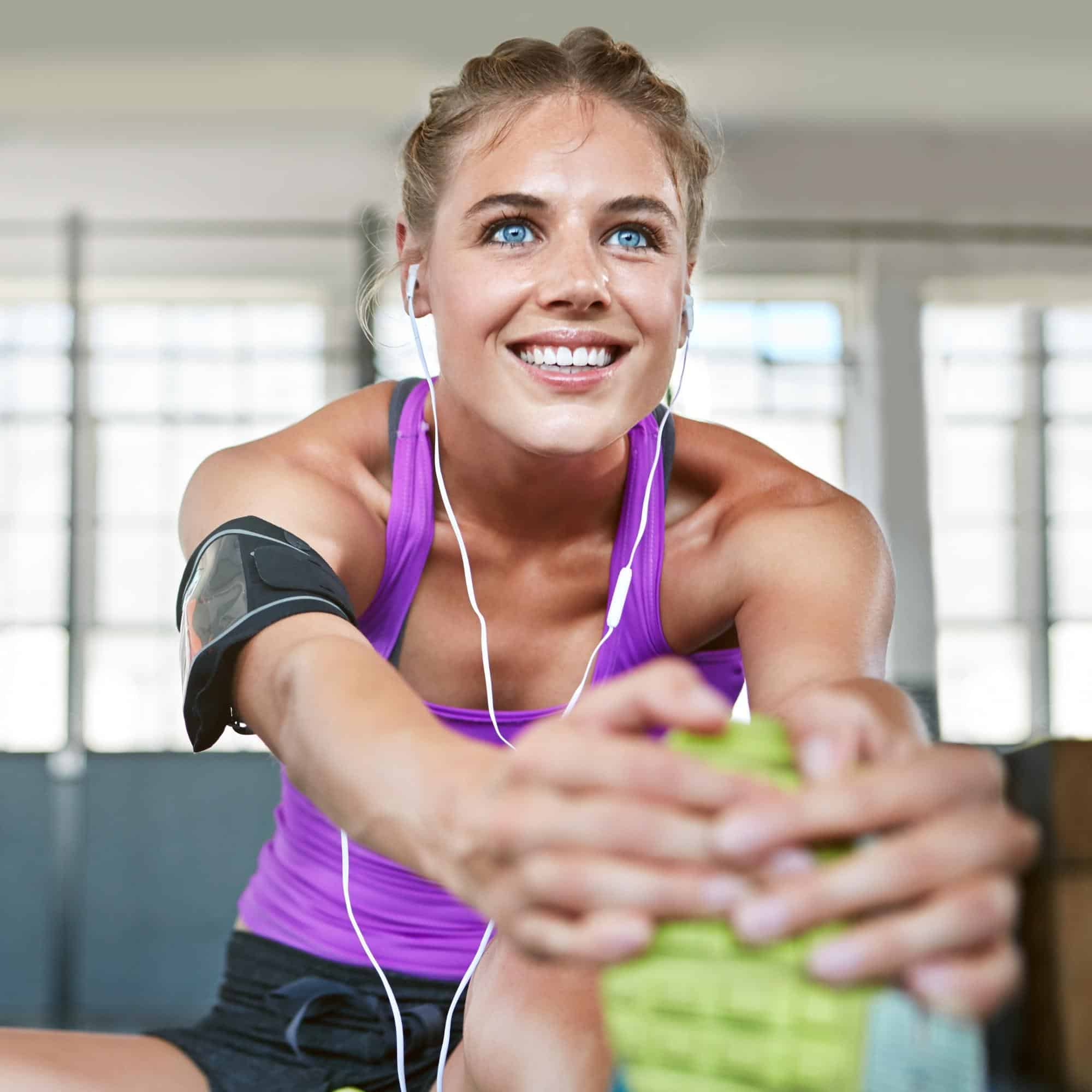 Young woman stretching before her workout.