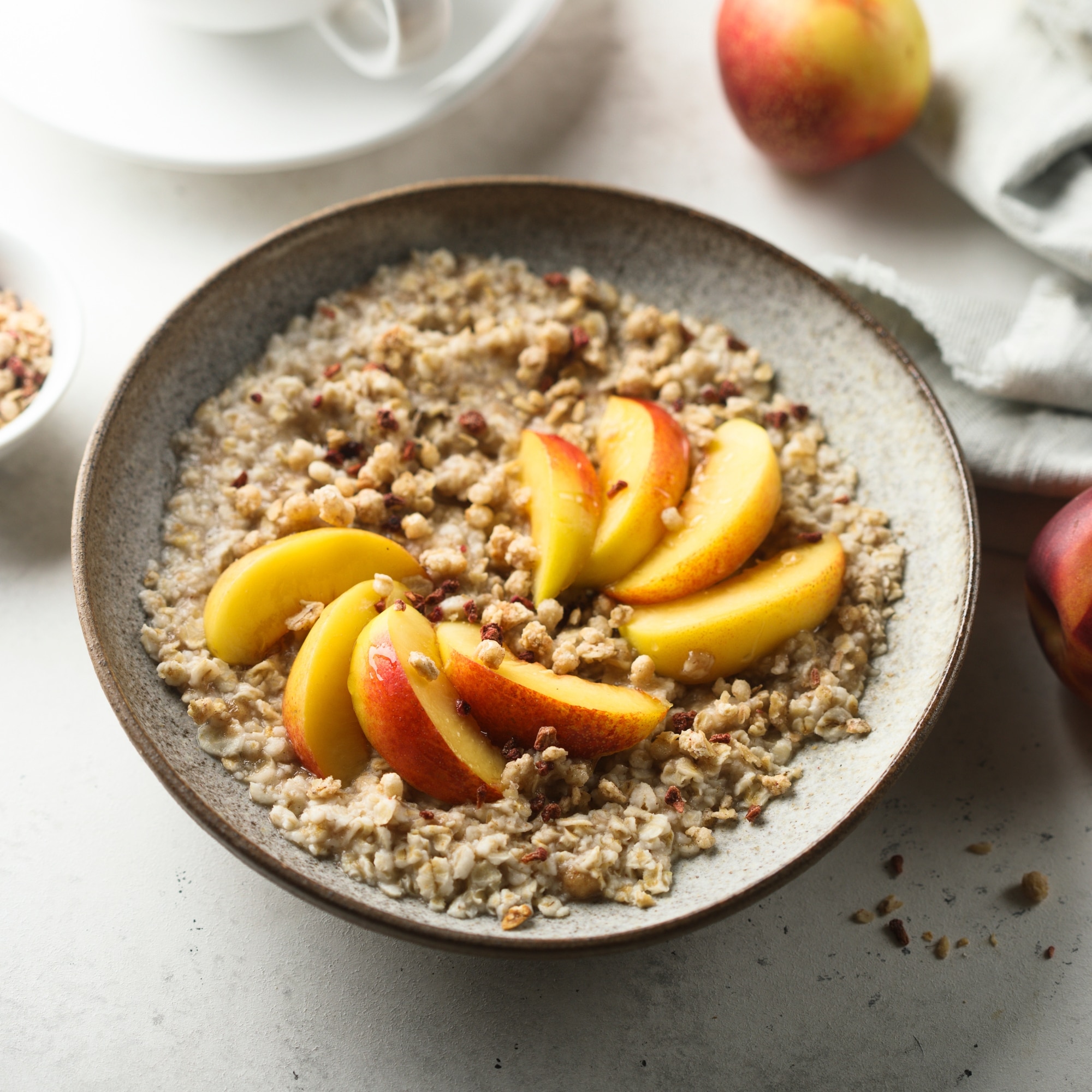 oatmeal with peaches and walnuts in a bowl