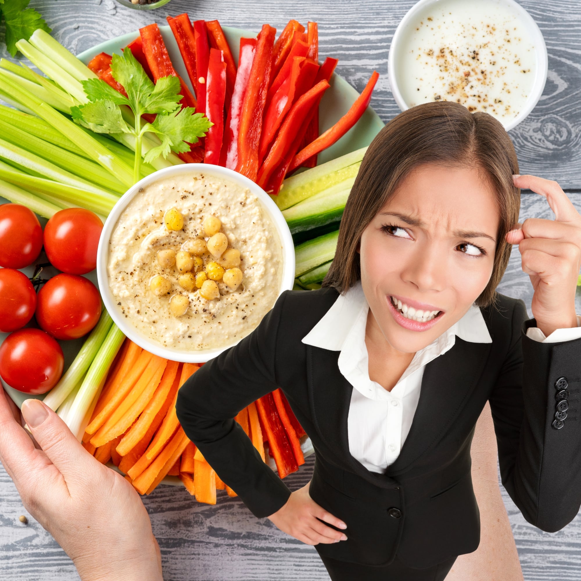 A plate full of vegetables and hummus with woman thinking.