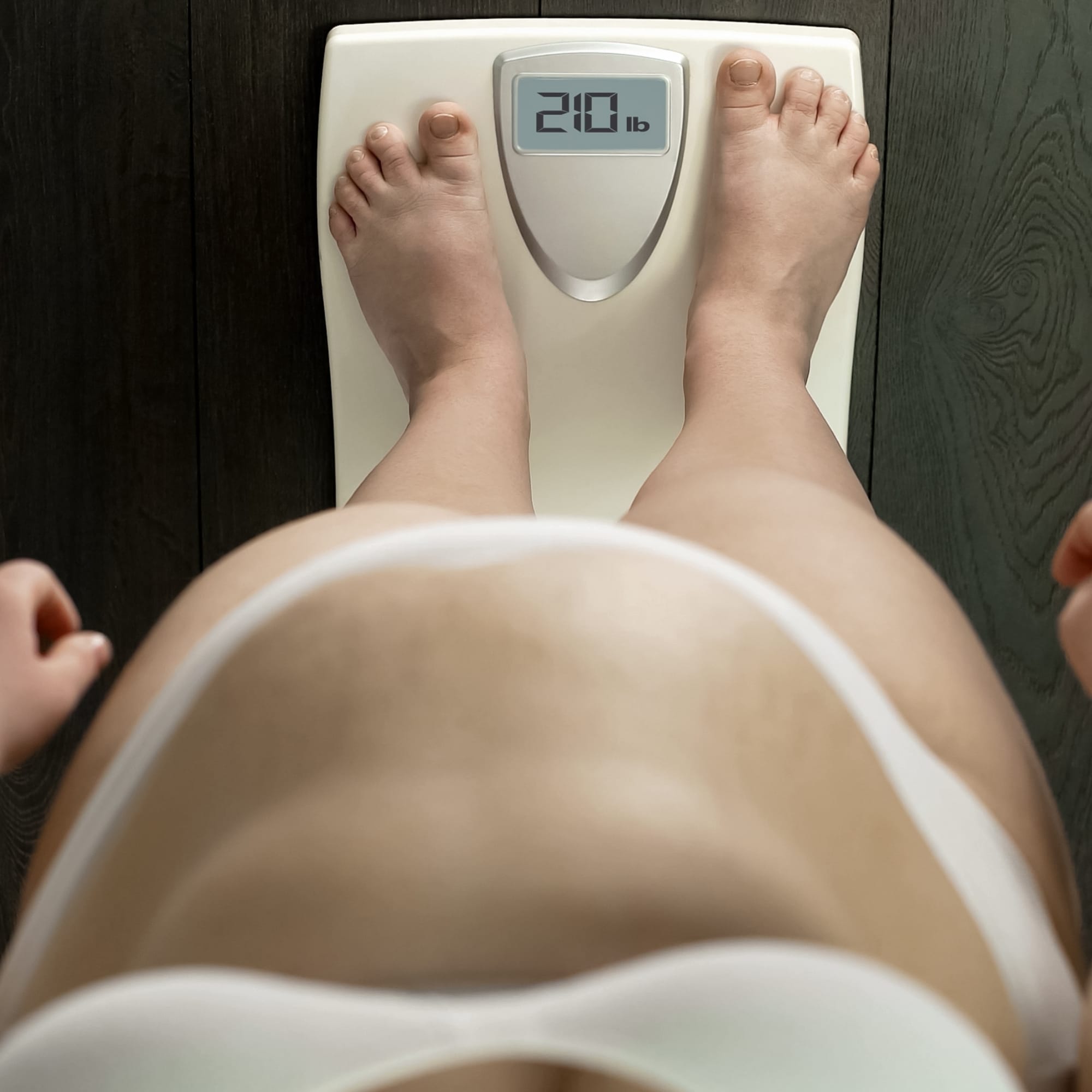 Your Questions About Metabolic Syndrome a person standing on a scale