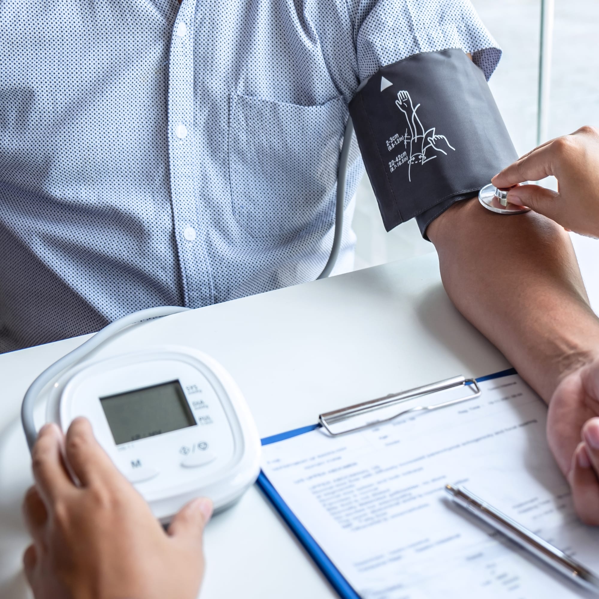 Doctor Checking Patient's Blood Pressure