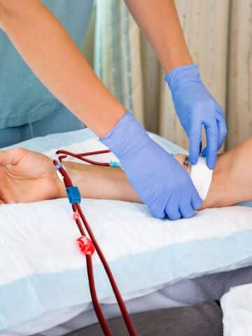 Nurse Starting Dialysis on Patient