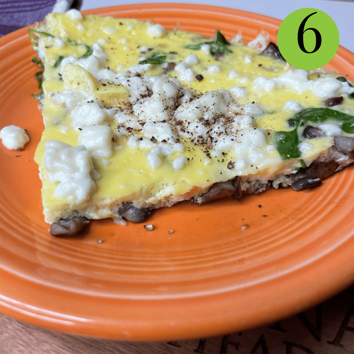 final slice of ¼th of the frittata with melted Feta and black pepper on top.