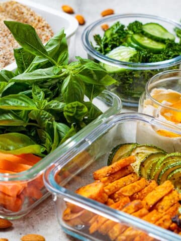 a bunch of food in clear containers on a table