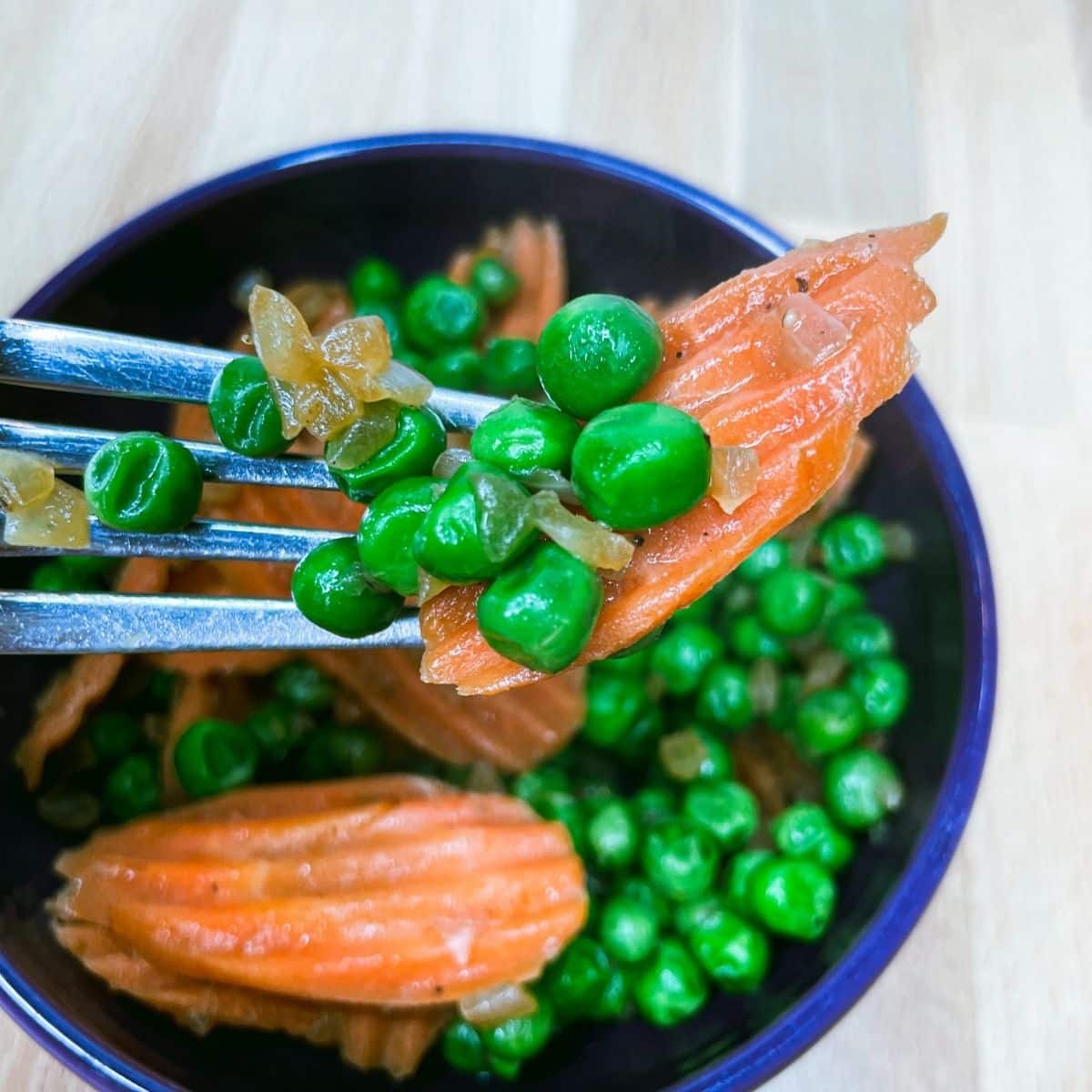 Peas and Carrots in a bowl.