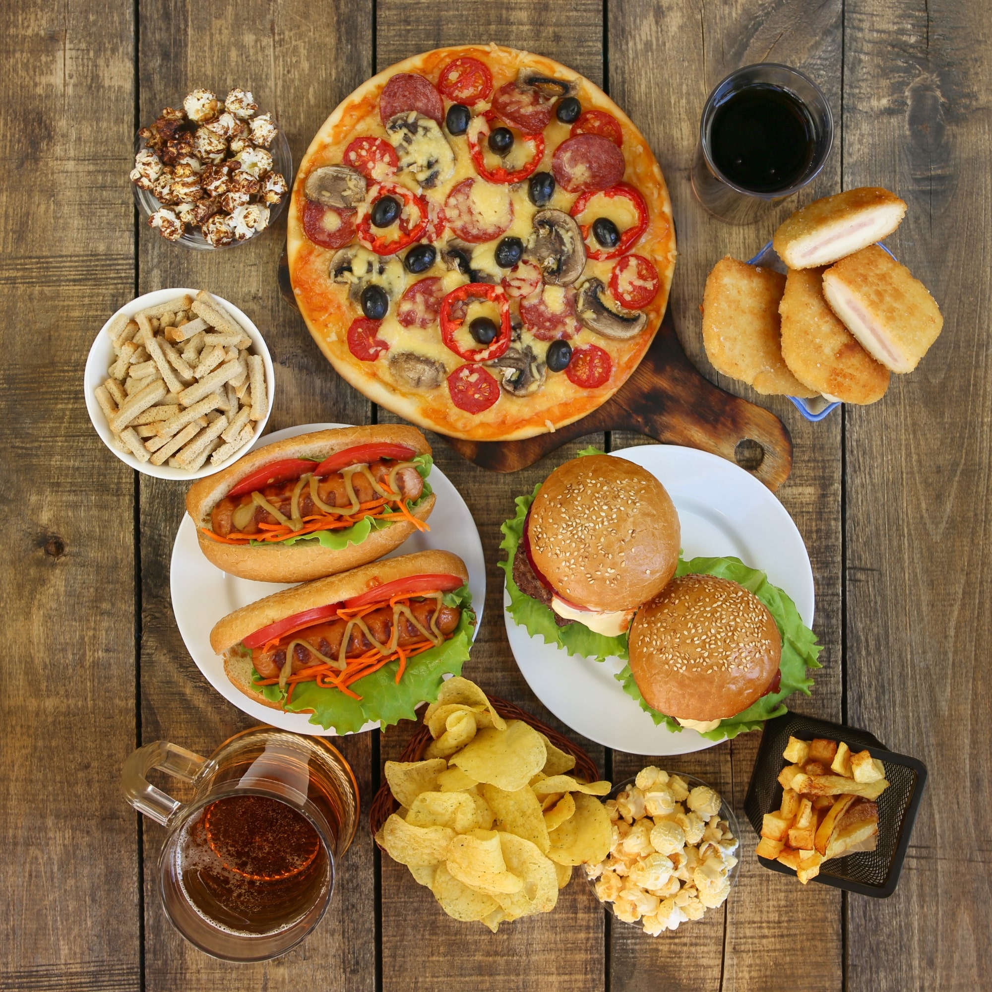 What Not To Eat And Drink With Renal Disease Fast food on old wooden background.
