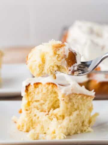 yummy flaky cinnamon roll on a fork