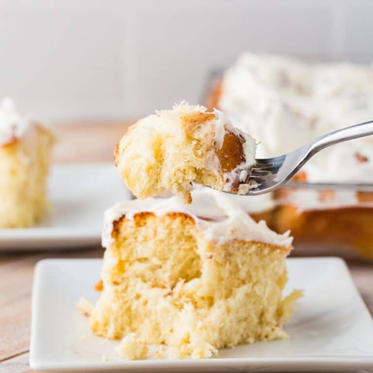 yummy flaky cinnamon roll on a fork