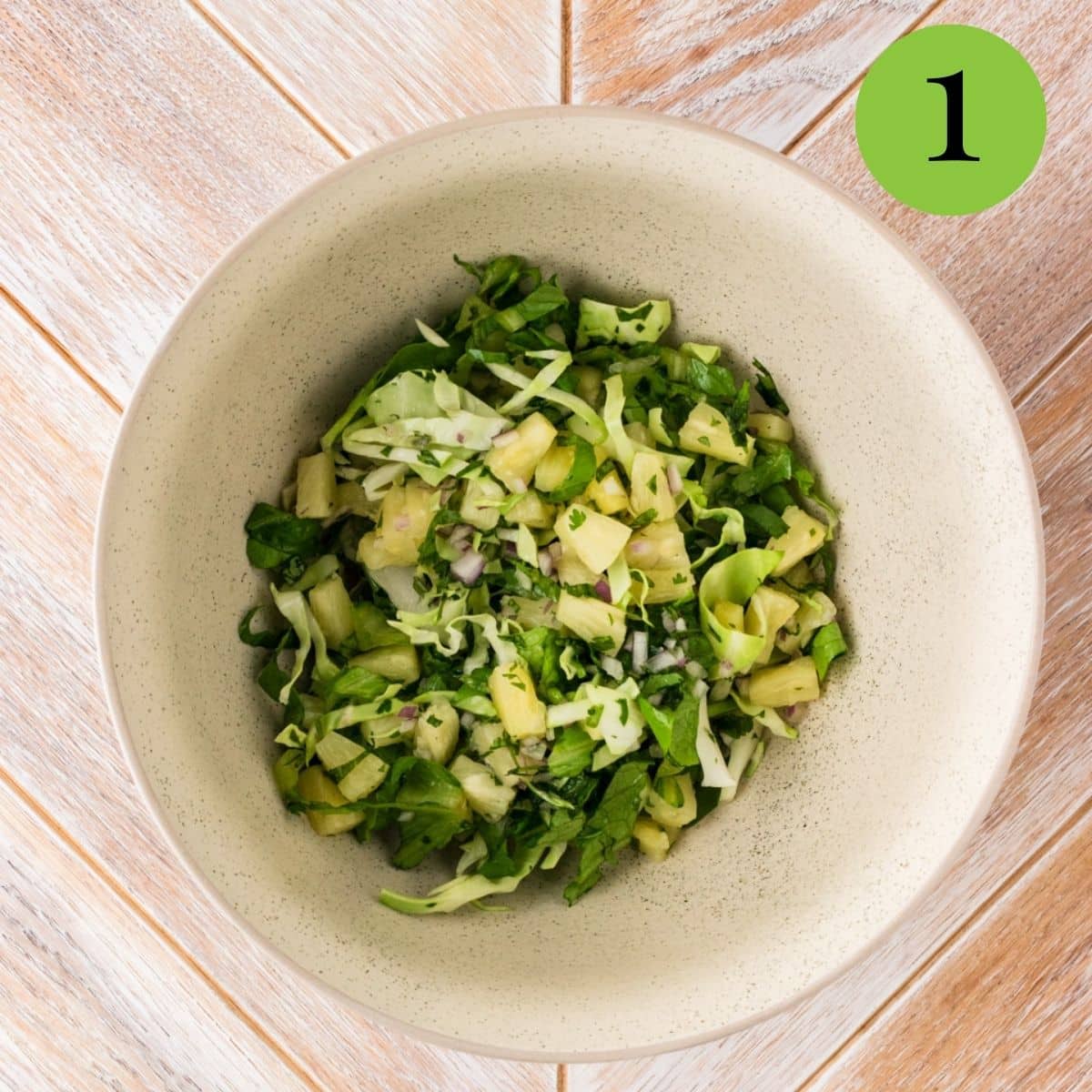 pineapple salad ingredients in a bowl before adding dressing