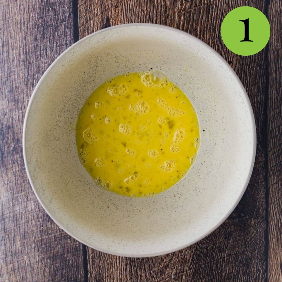Whisk eggs, water and pepper in a bowl.