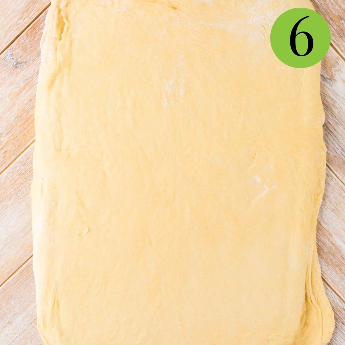 roll the dough out into roughly an 18-20 inch rectangle.