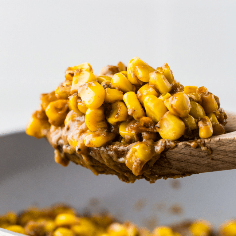 Skillet Corn on a wooden spoon.