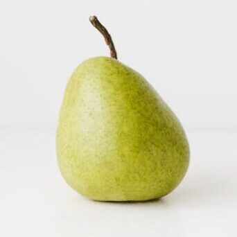 Fresh healthy pear on white surface