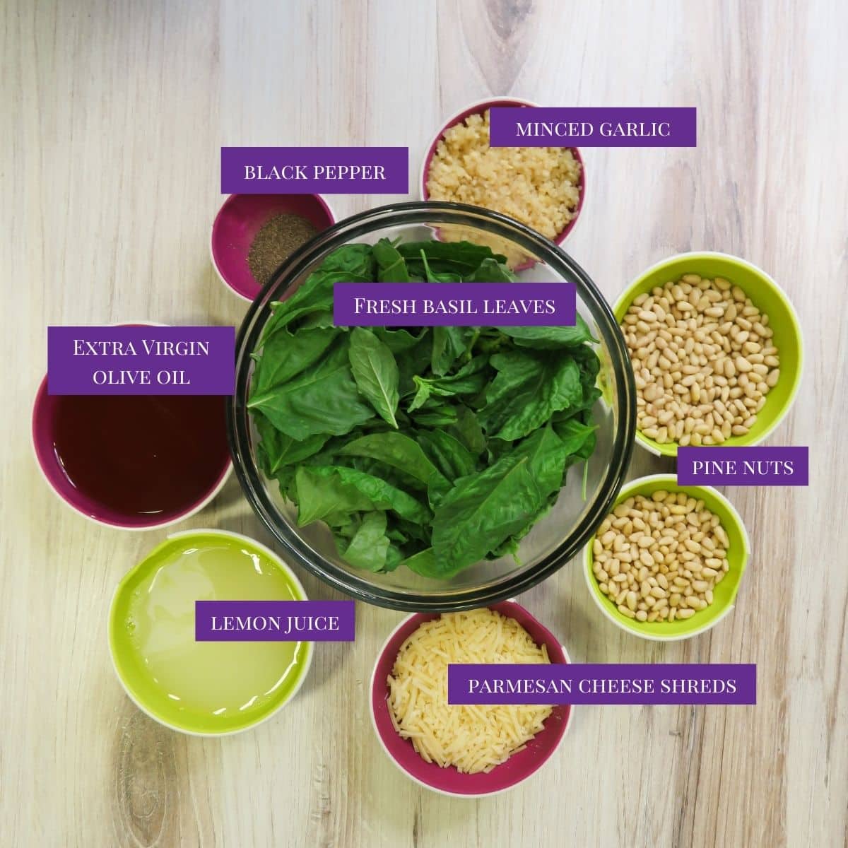 Ingredients for making Basil Pesto with Lemon laid out on a table.