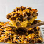 Cornbread Taco Bake for CKD being removed from the pan with a utensil.