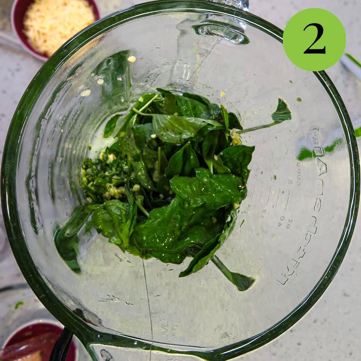 Basil and minced garlic in a blender. 