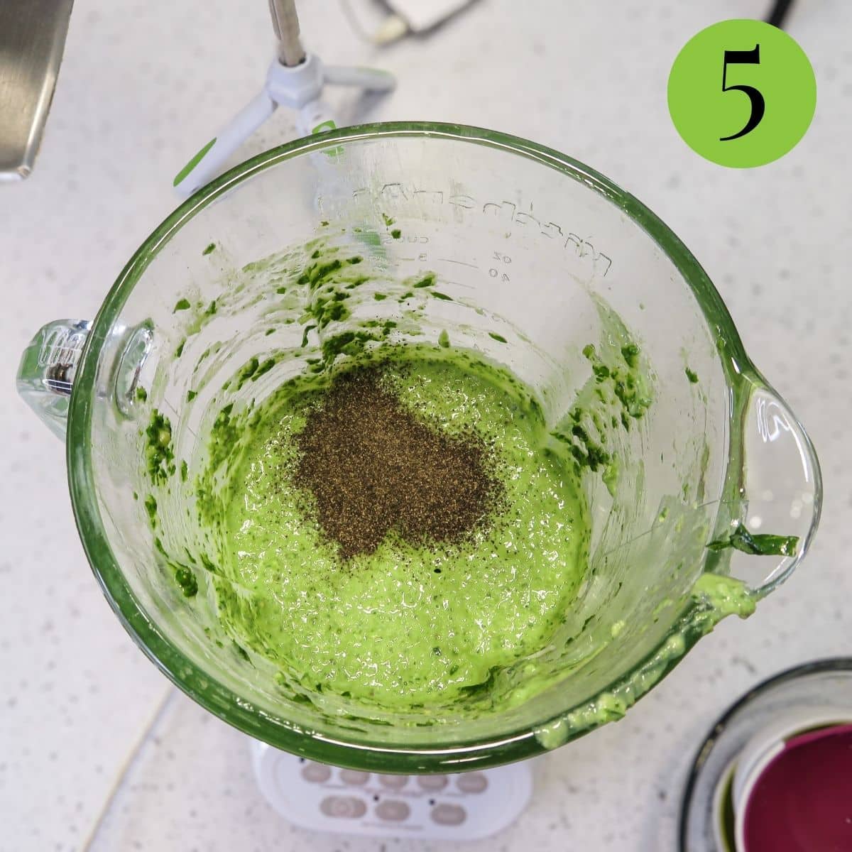 Add black pepper to the blender full of Basil Pesto with Lemon. 