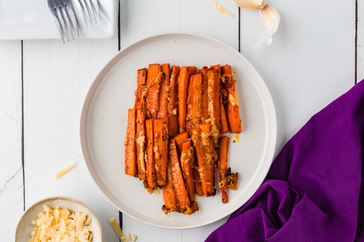Parmesan Carrots on a plate neatly arranged in rows