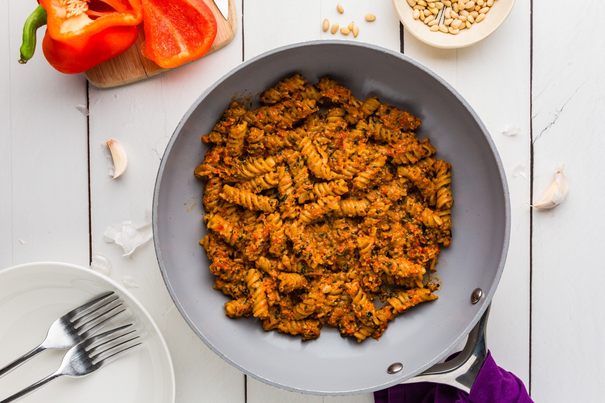Roasted Pepper Pesto Pasta mixed together in a pan with a fork nearby