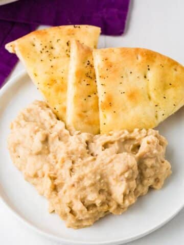 Plate of White Bean Dip Recipe with Seasoned Pita Chips
